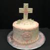 First Communion Cake
Butter Almond Pound Cake with Raspberry Mousse Filling and Vanilla ButterCream Frosting.
First Communion Cross made from White Chocolate Candy