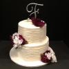 2  Tier Wedding Cake delivered   
Fort Mill, South Carolina  Top Tier Butter Almond Cake with Vanilla ButterCream Filling Bottom Tier Vanilla Pound Cake with Lemon Curd/Raspberry Glaze Filling Vanilla ButterCream Frosting.  Decorations Initial Cake Topper and Silk Flowers White/Dark Plum.
