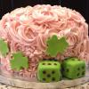 This is a St. Patrick's Day Cake for a Bunco Party.  It is a  Strawberry Cake with Strawberry Cream Cheese Filling and Pink Champagne Frosting.  