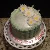 This April / Spring Birthday Cake is an Almond Cake with Vanilla Filling and Frosting.  It is decorated with Wafer Paper Butterflies and Fondant Daisies. 