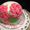 This is a beautiful Spring Birthday Cake.  It is a strawberry cake with pink hydrangeas.  It has strawberry cream cheese filling and vanilla buttercream frosting. 