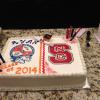 This graduation cake serves 50 people. It is a double layer vanilla pound sheet cake with raspberry filling. 