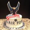 This graduation cake is chocolate marble. Buttercream with vanilla buttercream frosting.  The soldier wings and flag are fondant. 