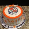 This graduation cake is a butter almond pound cake with vanilla buttercream filling and frosting. 